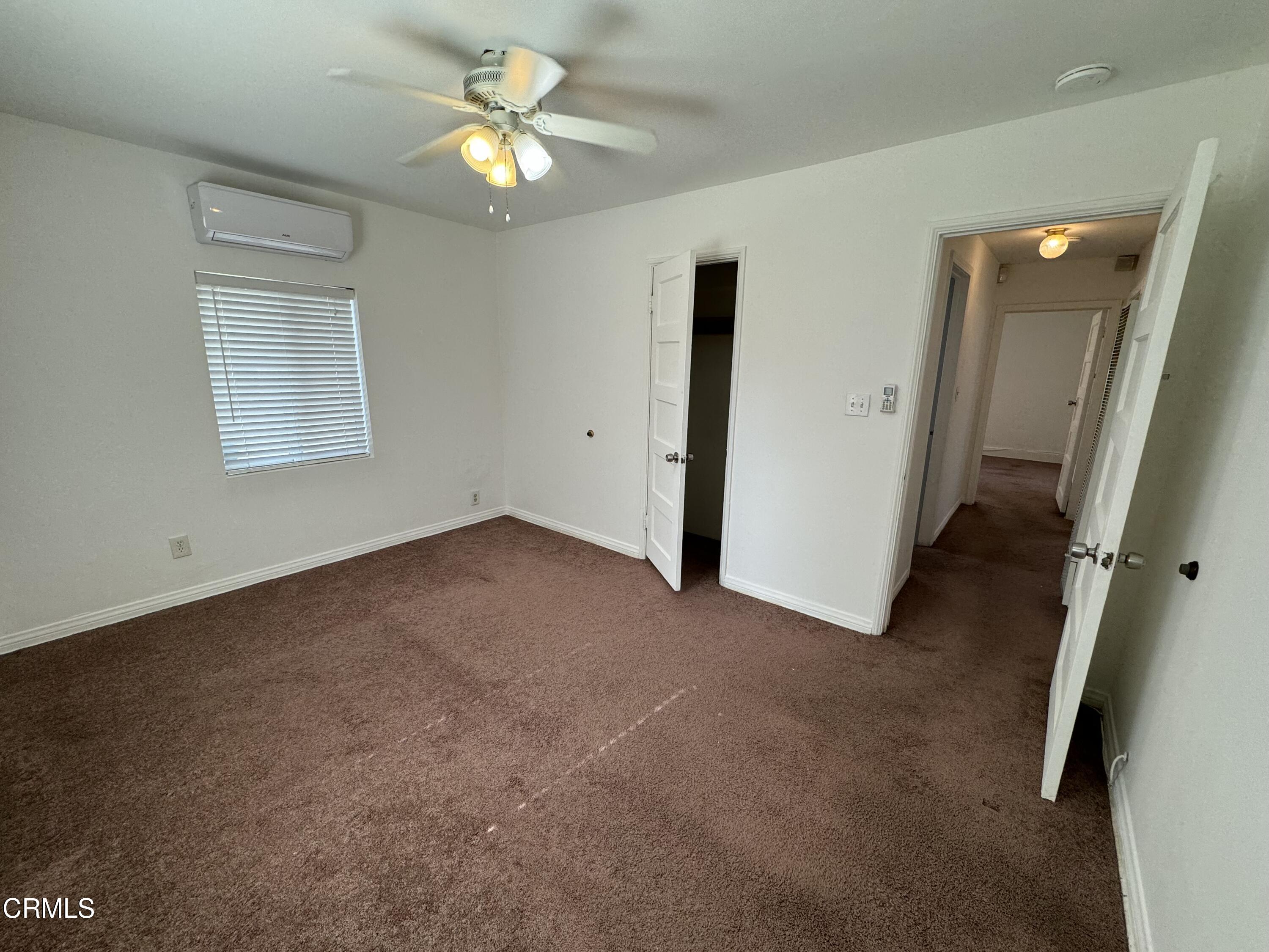 550 MacDonald Street Pasadena, CA 91103 - Photo 51 of 63 an empty room with a ceiling fan and a window