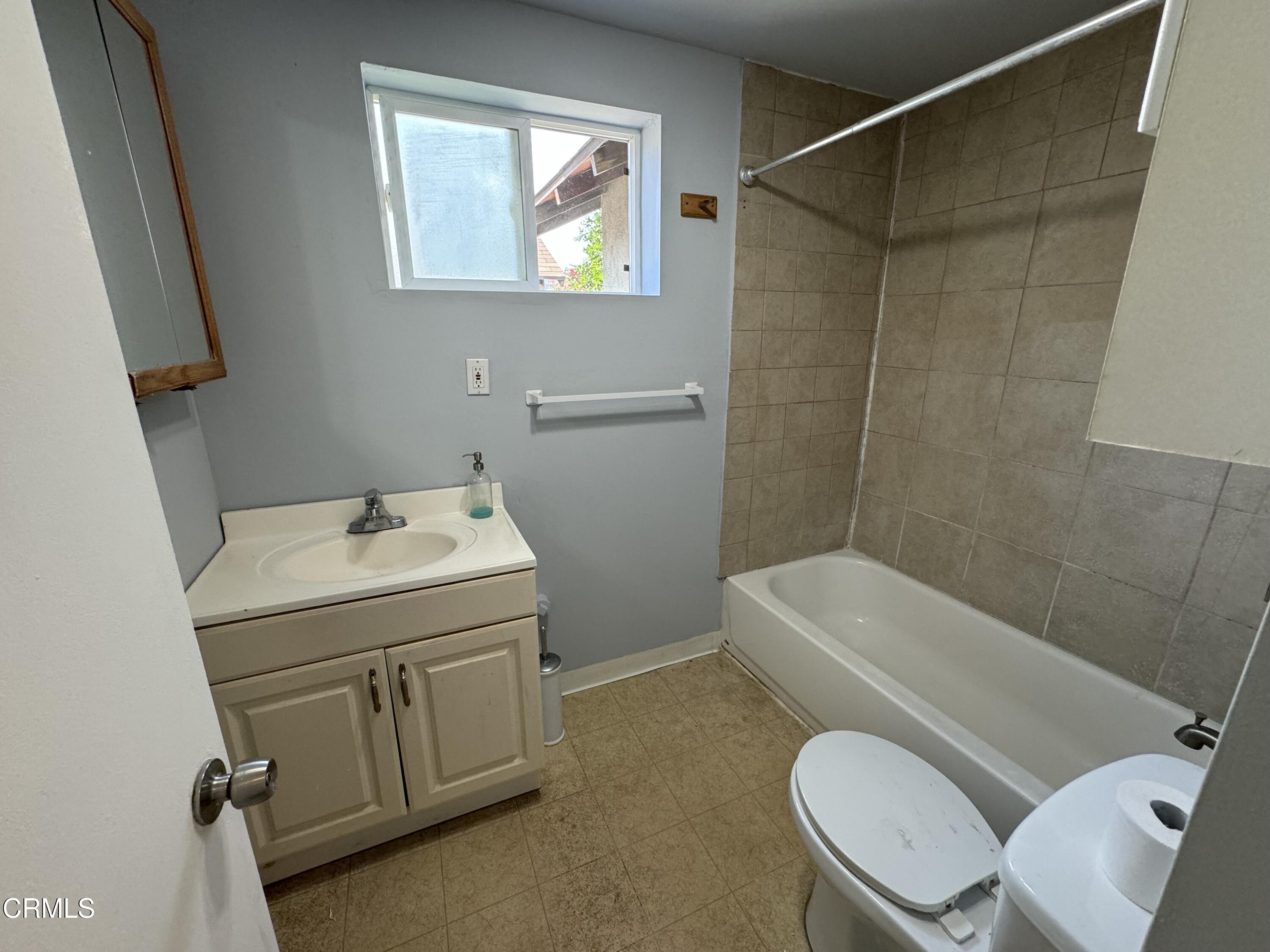 550 MacDonald Street Pasadena, CA 91103 - Photo 52 of 63 a bathroom with a sink a toilet and shower