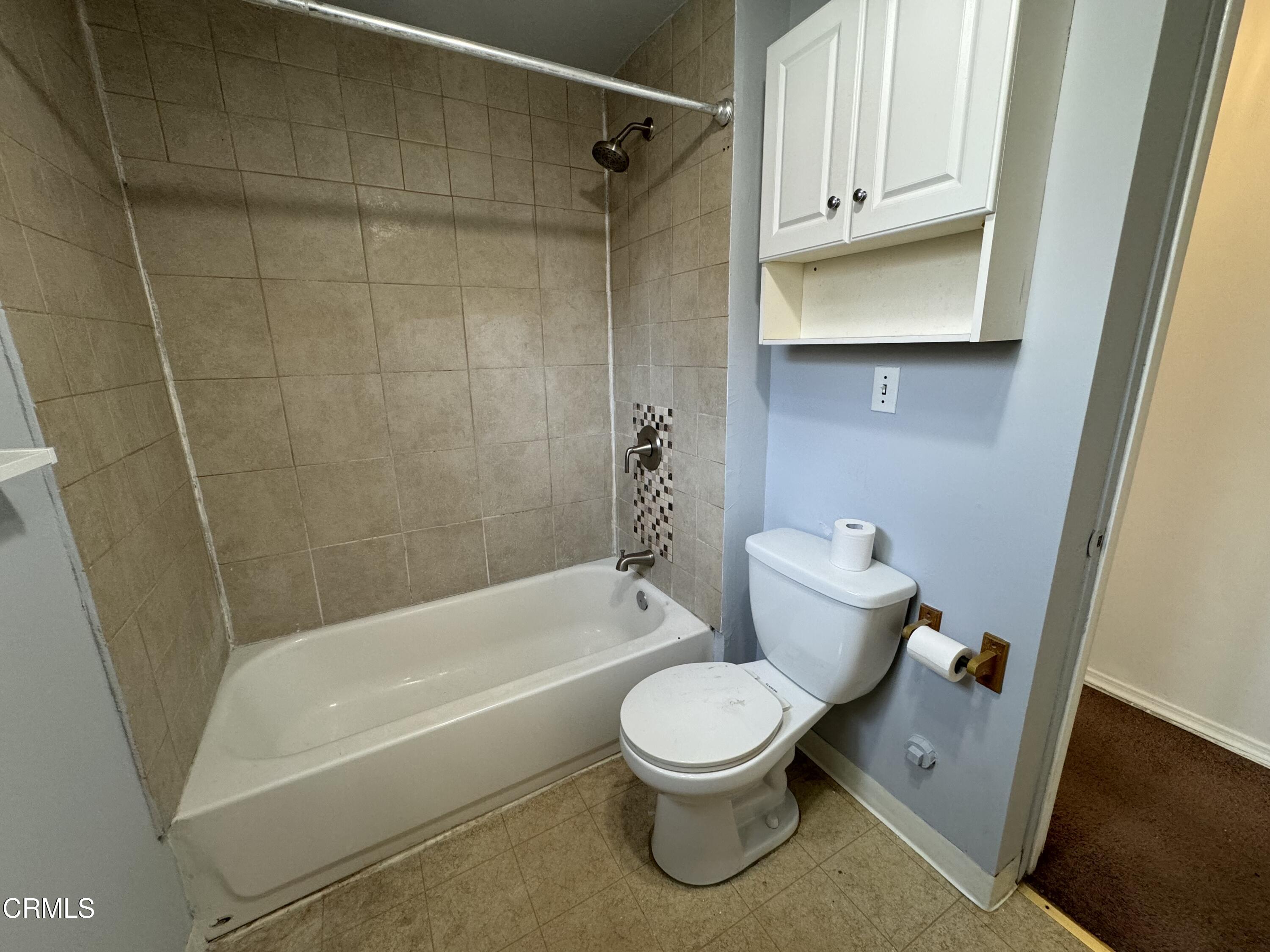 550 MacDonald Street Pasadena, CA 91103 - Photo 53 of 63 a white toilet sitting next to a bath tub