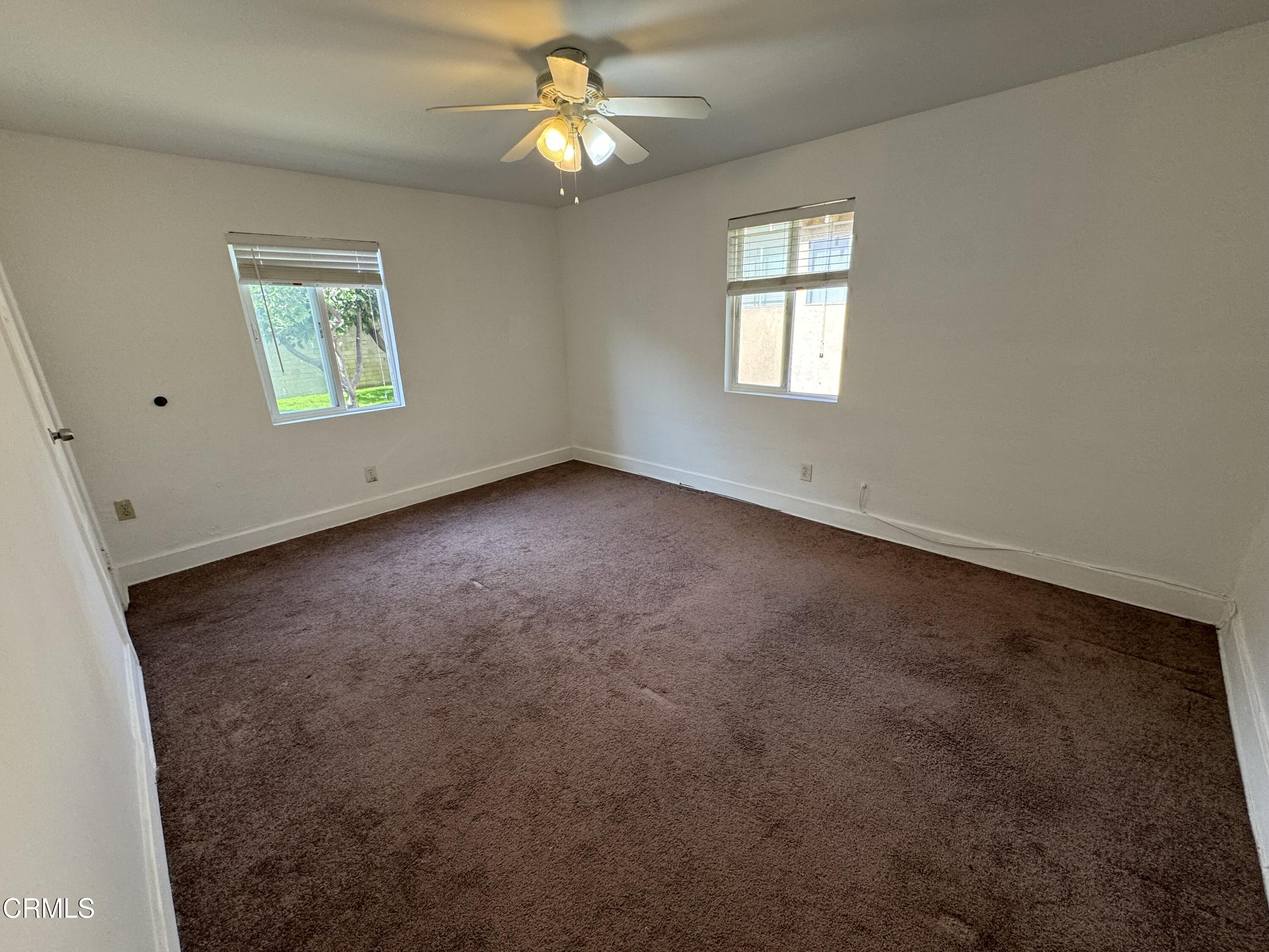 550 MacDonald Street Pasadena, CA 91103 - Photo 54 of 63 an empty room with windows and fan