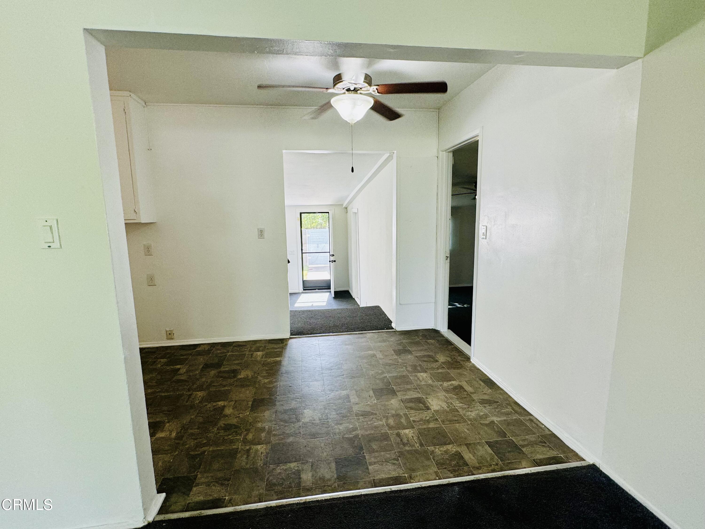 550 MacDonald Street Pasadena, CA 91103 - Photo 8 of 63 a view of a hallway with a chandelier fan and wooden floor