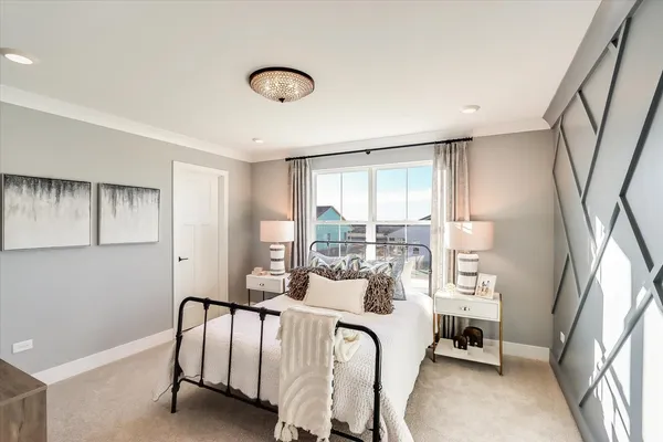 a bedroom with furniture and a window
