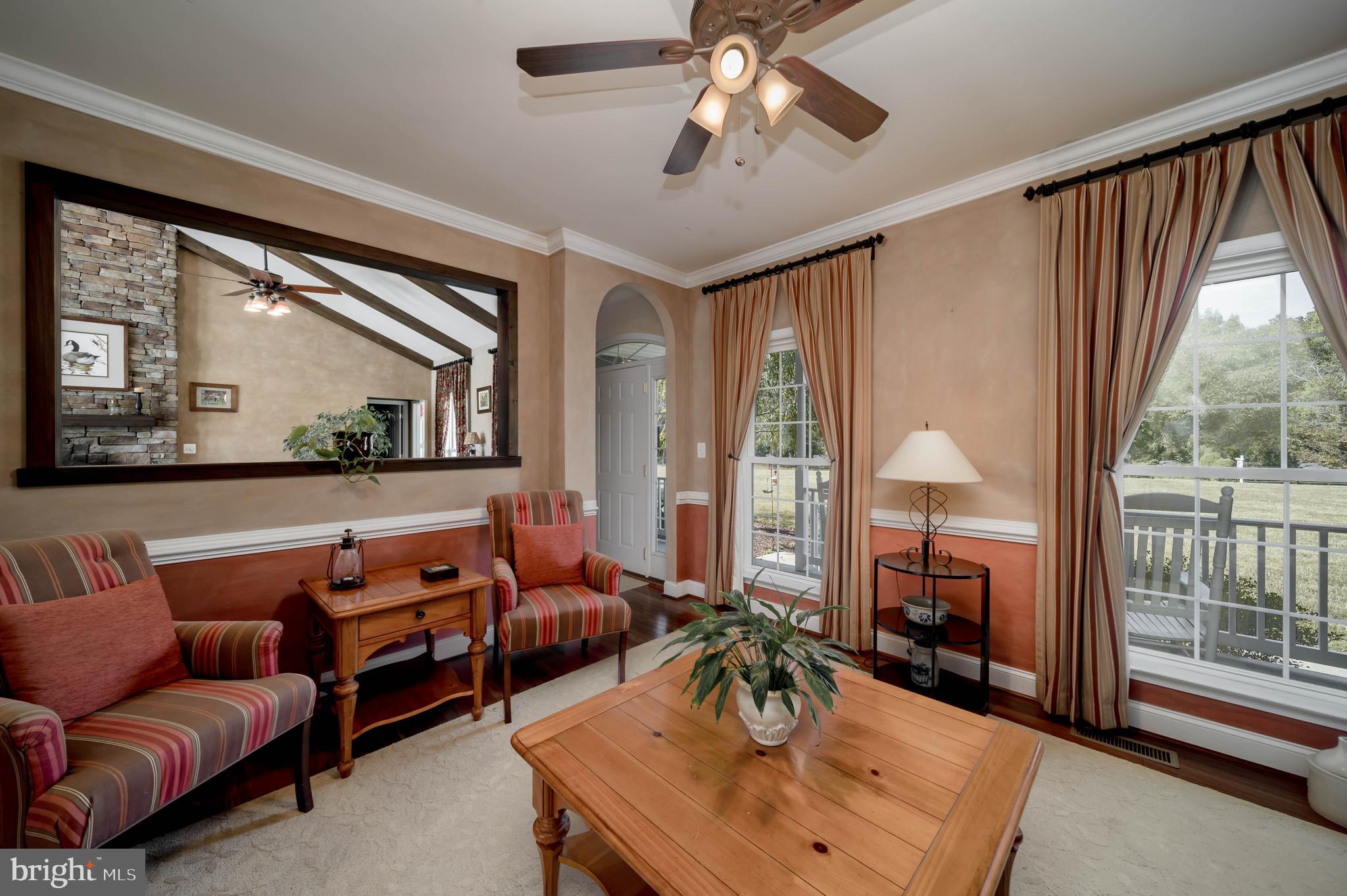 7295 Flint Hill Road Owings, MD 20736 - Photo 13 of 39 a living room with furniture and a large window