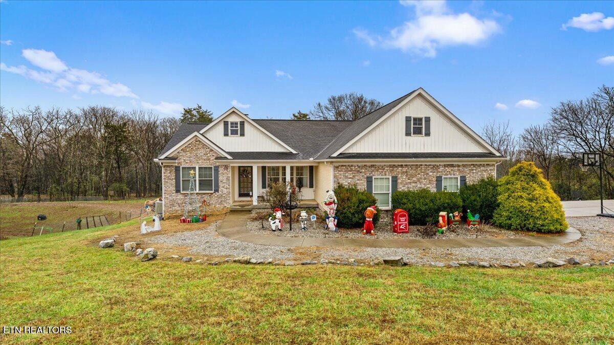 a front view of house with yard outdoor seating and barbeque oven