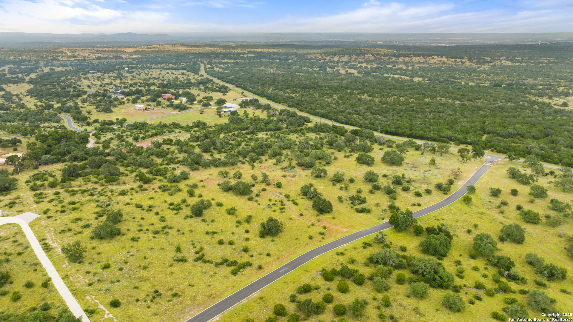 Lot 37 Vista Ridge Round Mountain, TX 78663 - Photo 30 of 30 a view of a city with an ocean view