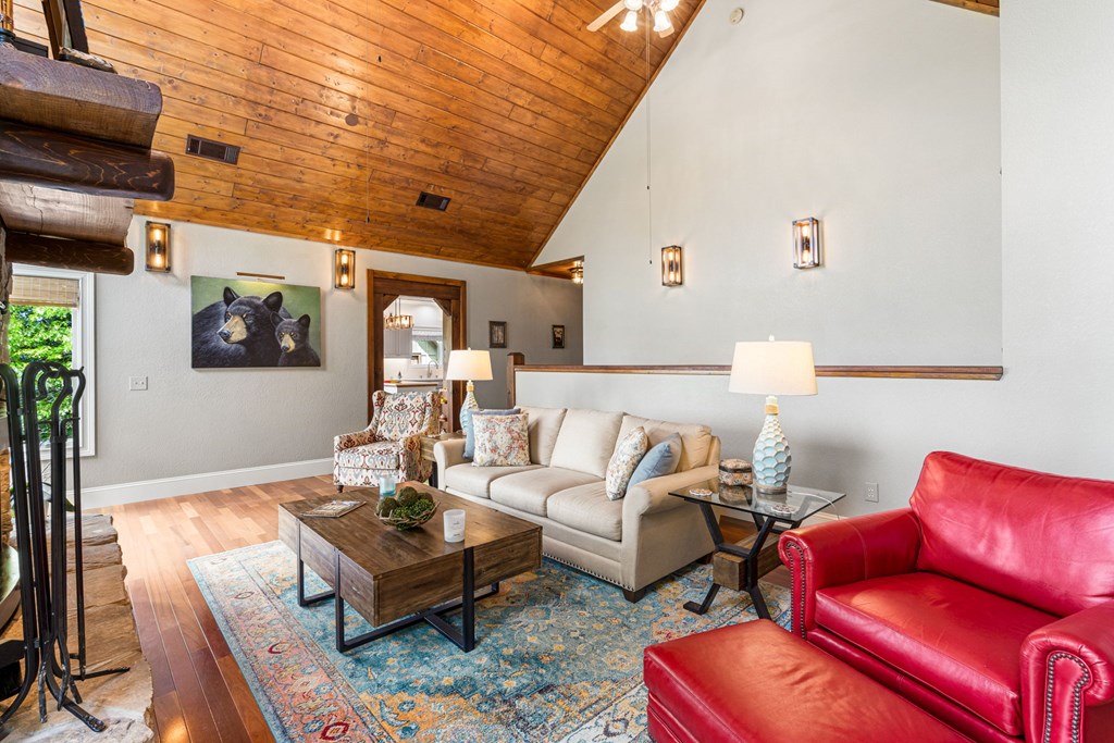 5125 Mineral Springs Road Young Harris, GA 30582 - Photo 16 of 62 a living room with furniture a rug and a chandelier