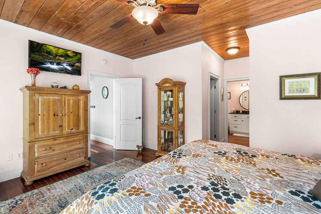 5125 Mineral Springs Road Young Harris, GA 30582 - Photo 22 of 62 a bedroom with a bed and a flat screen tv