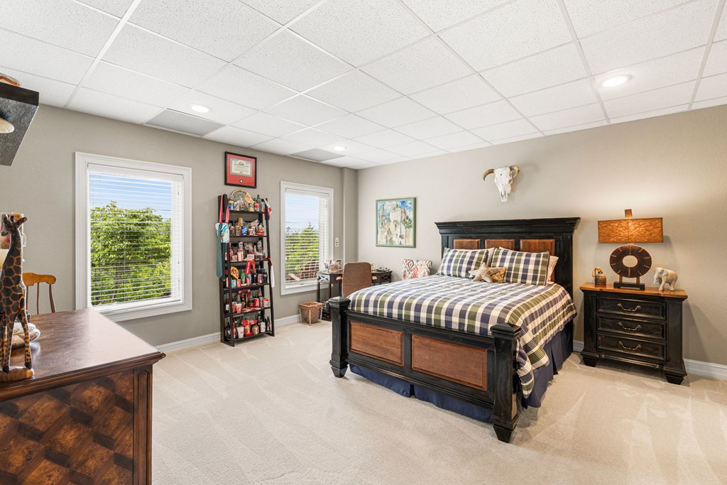 5125 Mineral Springs Road Young Harris, GA 30582 - Photo 23 of 62 a spacious bedroom with a bed a dresser and a large window