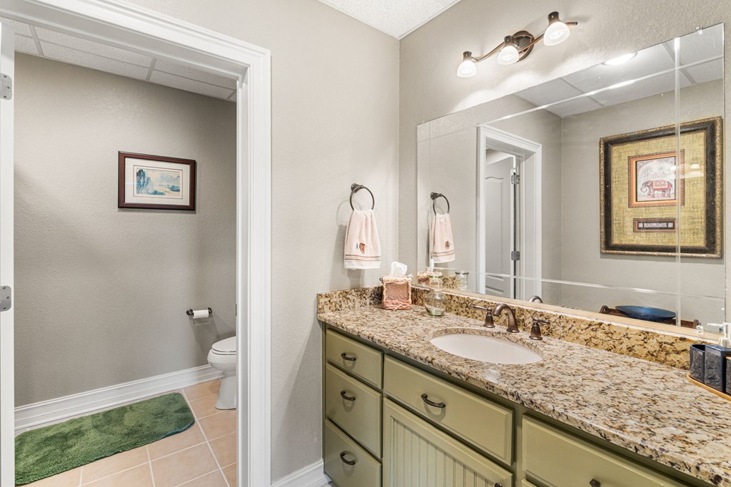 5125 Mineral Springs Road Young Harris, GA 30582 - Photo 31 of 62 a bathroom with a granite countertop double vanity sink and a mirror