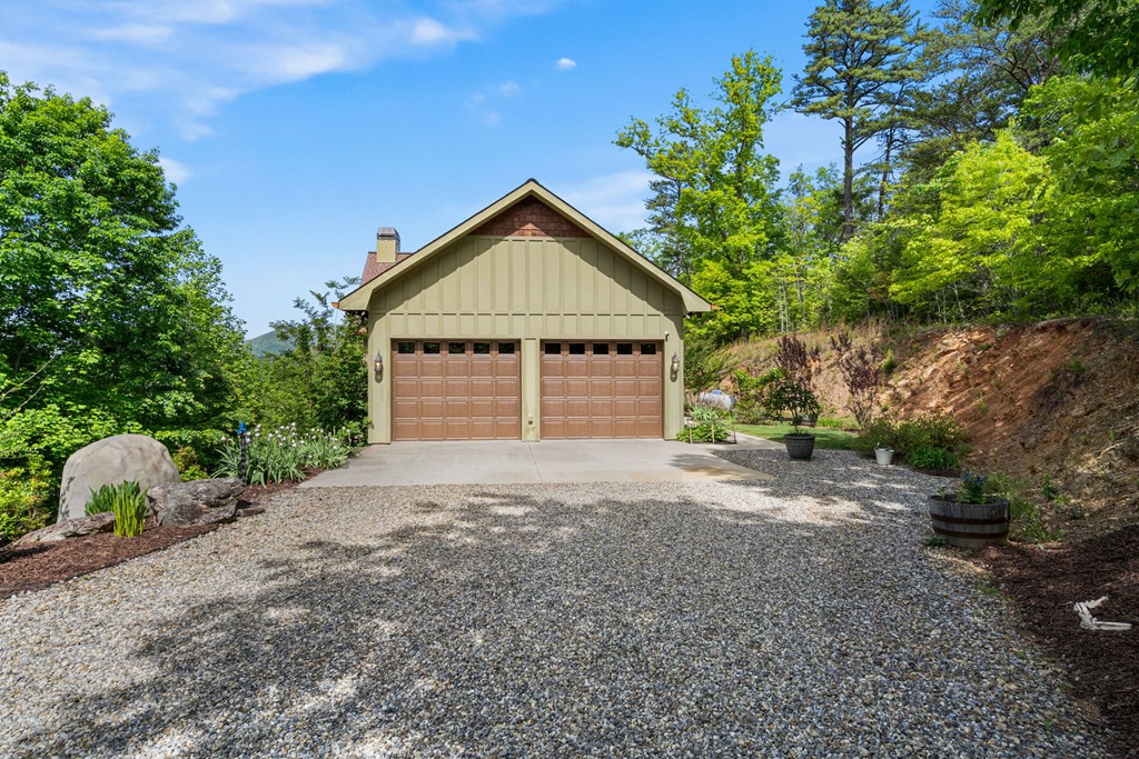 5125 Mineral Springs Road Young Harris, GA 30582 - Photo 55 of 62 a front view of a house with a yard and garage