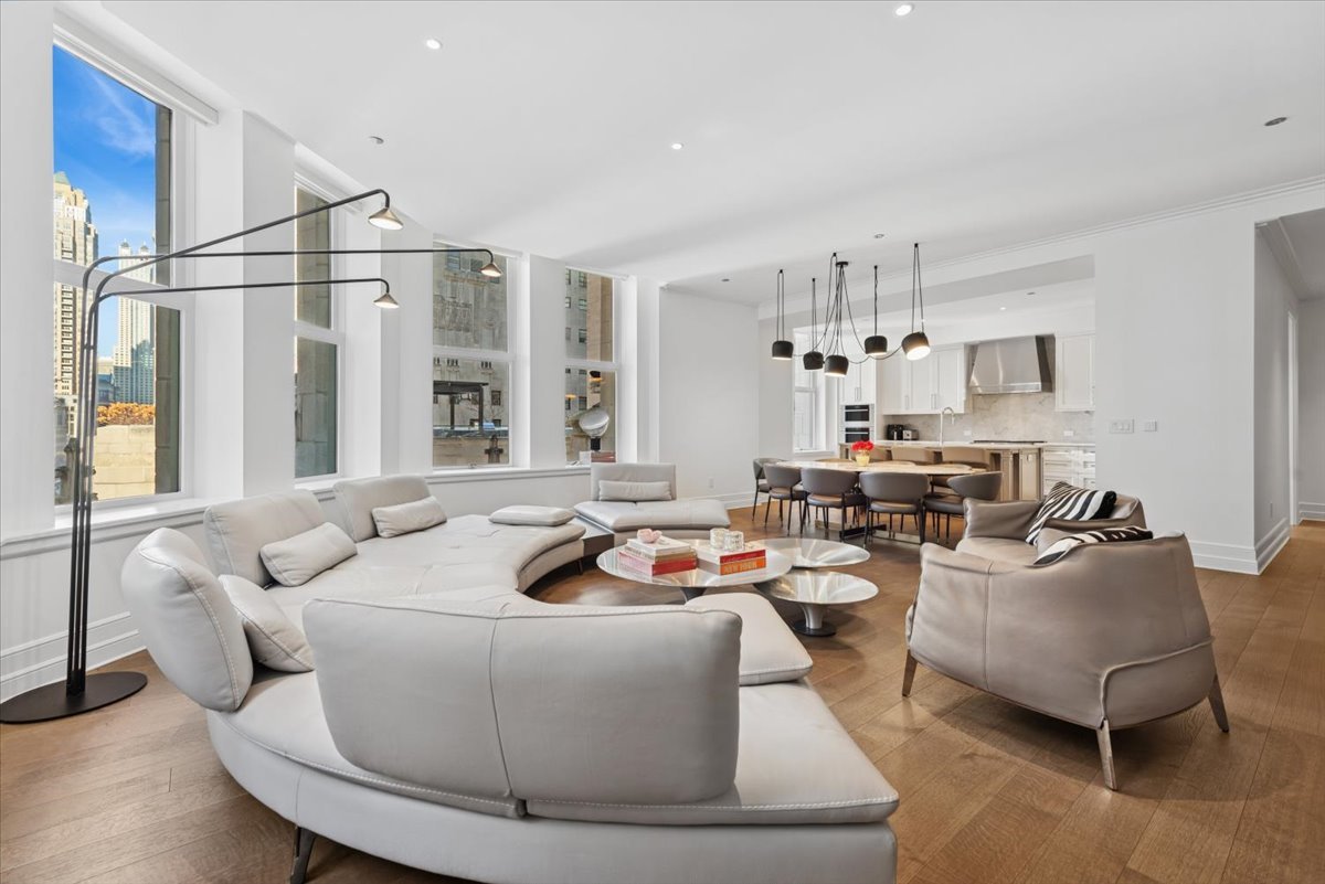 435 North Michigan Avenue, Unit 503 Chicago, IL 60611 - Photo 11 of 48 a living room with furniture and a chandelier