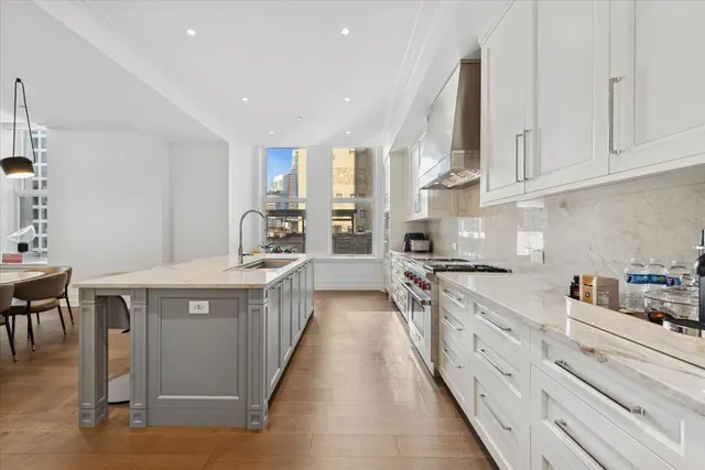 a kitchen with stainless steel appliances granite countertop a stove and a sink