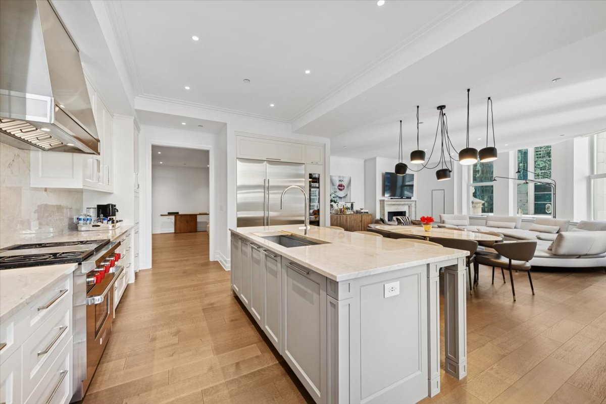 435 North Michigan Avenue, Unit 503 Chicago, IL 60611 - Photo 19 of 48 a large kitchen with stainless steel appliances a stove and a refrigerator
