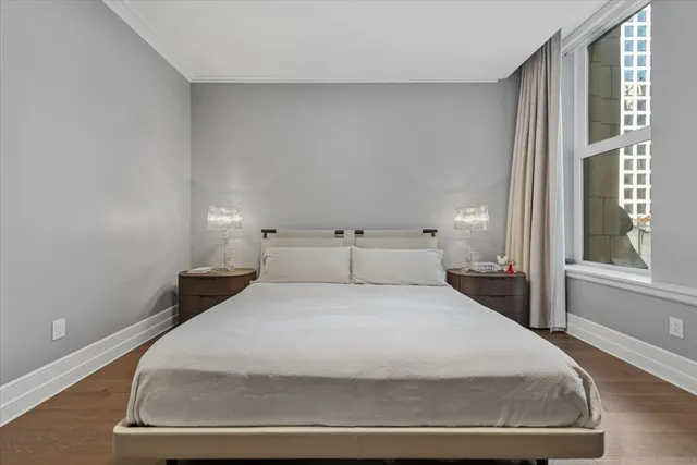 a large white bed in a white room