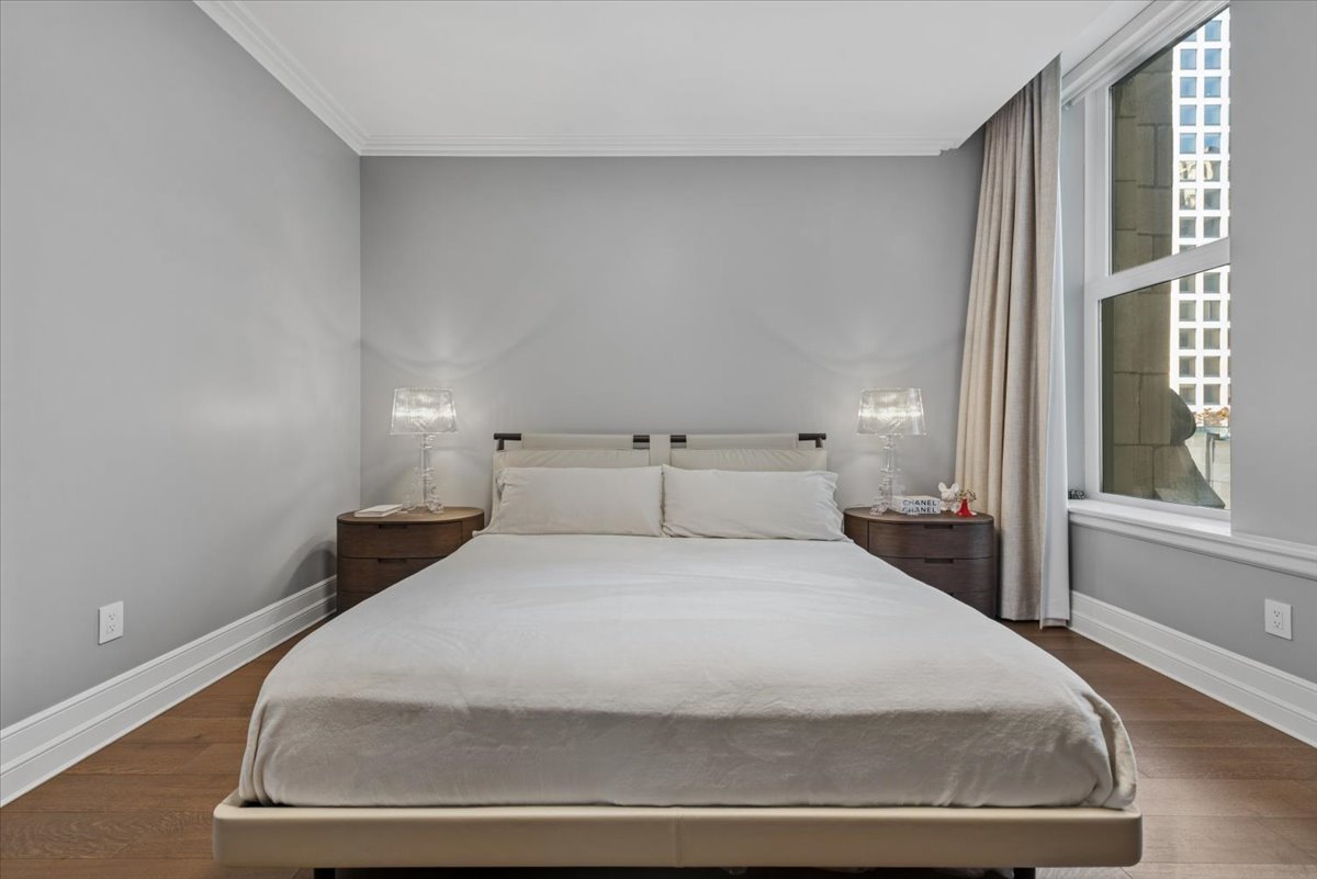 435 North Michigan Avenue, Unit 503 Chicago, IL 60611 - Photo 23 of 48 a large white bed in a white room