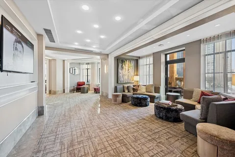 a living room with furniture large window and couch