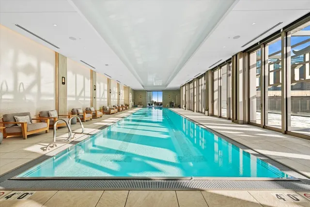 a view of swimming pool with outdoor seating