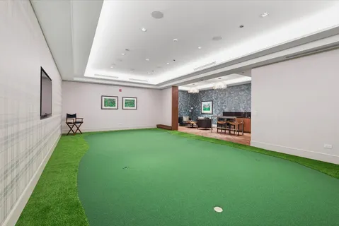 a view of a room with furniture and a garden