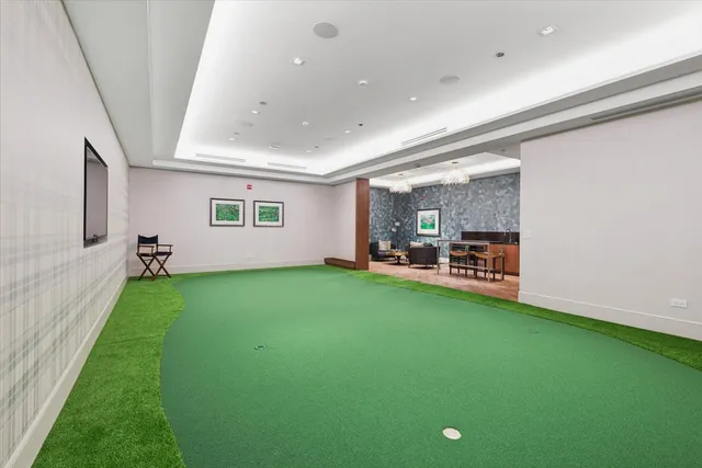 a view of a room with furniture and a garden