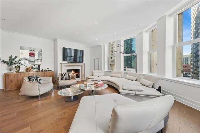 a living room with furniture fireplace and a flat screen tv