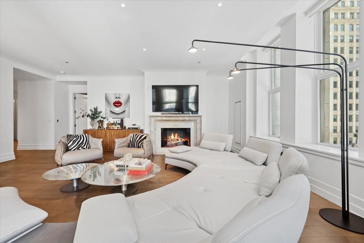435 North Michigan Avenue, Unit 503 Chicago, IL 60611 - Photo 9 of 48 a living room with furniture a fireplace and a flat screen tv