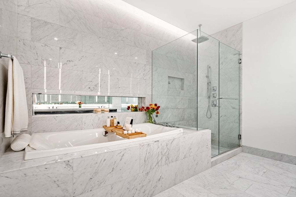 363 East Wacker Drive, Unit 4103 Chicago, IL 60601 - Photo 11 of 34 a large white kitchen with a large window and stainless steel appliances