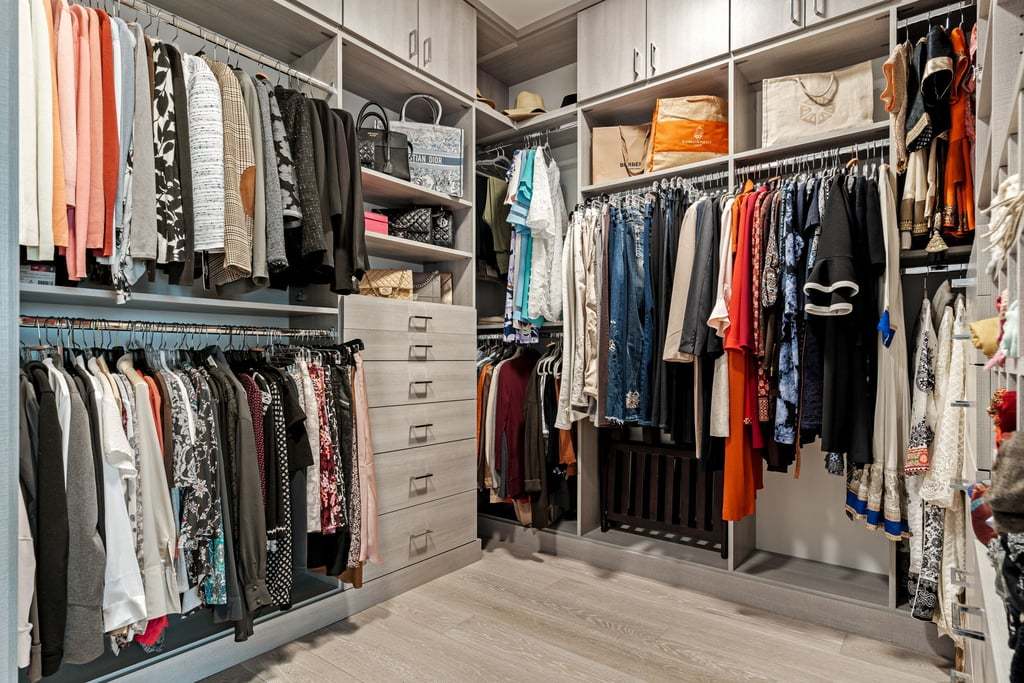 363 East Wacker Drive, Unit 4103 Chicago, IL 60601 - Photo 12 of 34 a view of walk in closet with clothes and shoes