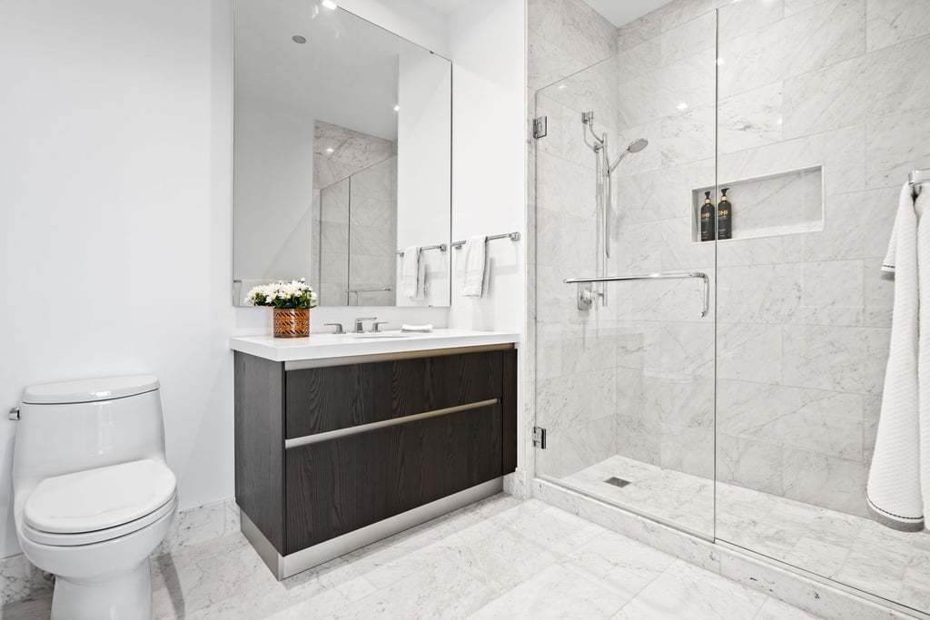 363 East Wacker Drive, Unit 4103 Chicago, IL 60601 - Photo 14 of 34 a bathroom with a sink toilet and shower
