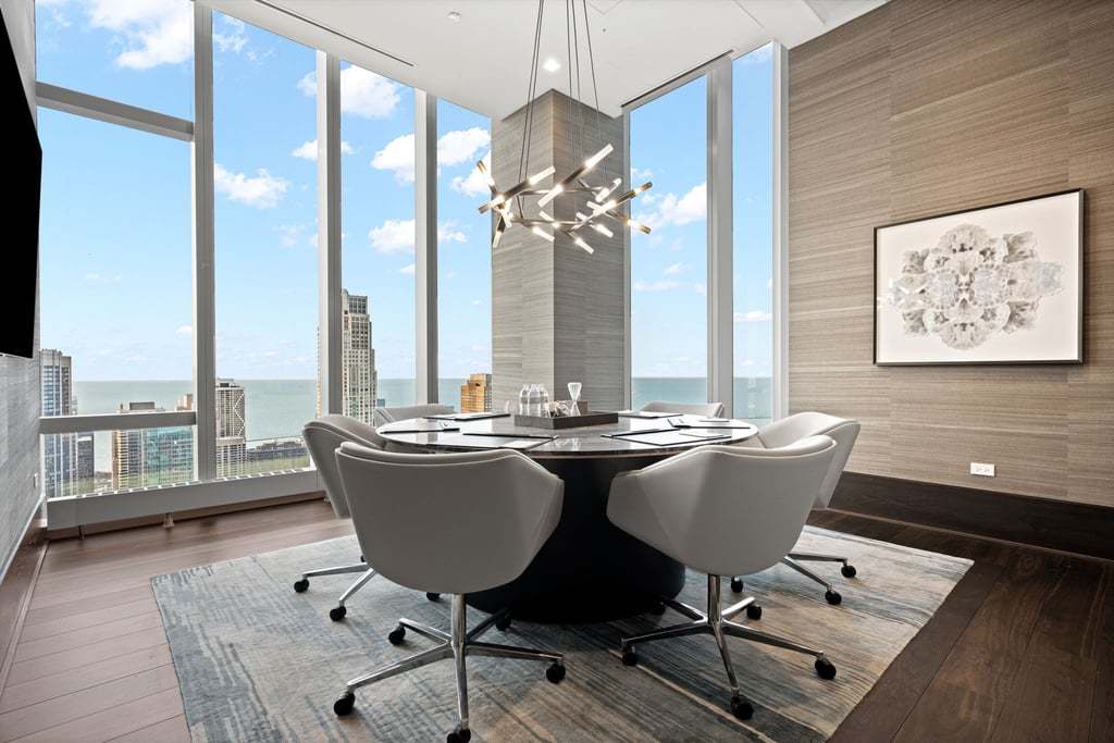 363 East Wacker Drive, Unit 4103 Chicago, IL 60601 - Photo 25 of 34 a view of a dining room with furniture window and wooden floor