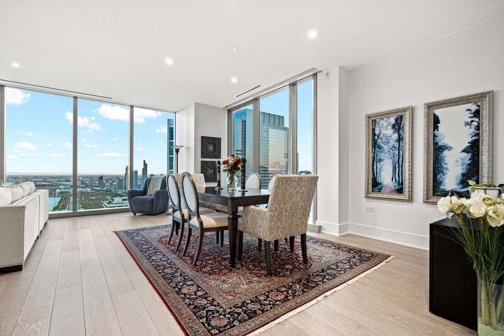 363 East Wacker Drive, Unit 4103 Chicago, IL 60601 - Photo 4 of 34 a living room with furniture a large window and wooden floor