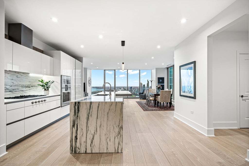 363 East Wacker Drive, Unit 4103 Chicago, IL 60601 - Photo 7 of 34 a living room with furniture and a large window