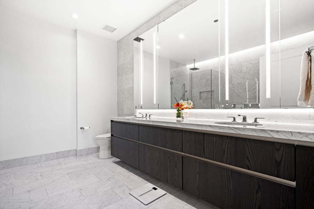363 East Wacker Drive, Unit 4103 Chicago, IL 60601 - Photo 10 of 34 a bathroom with double sink and a mirror