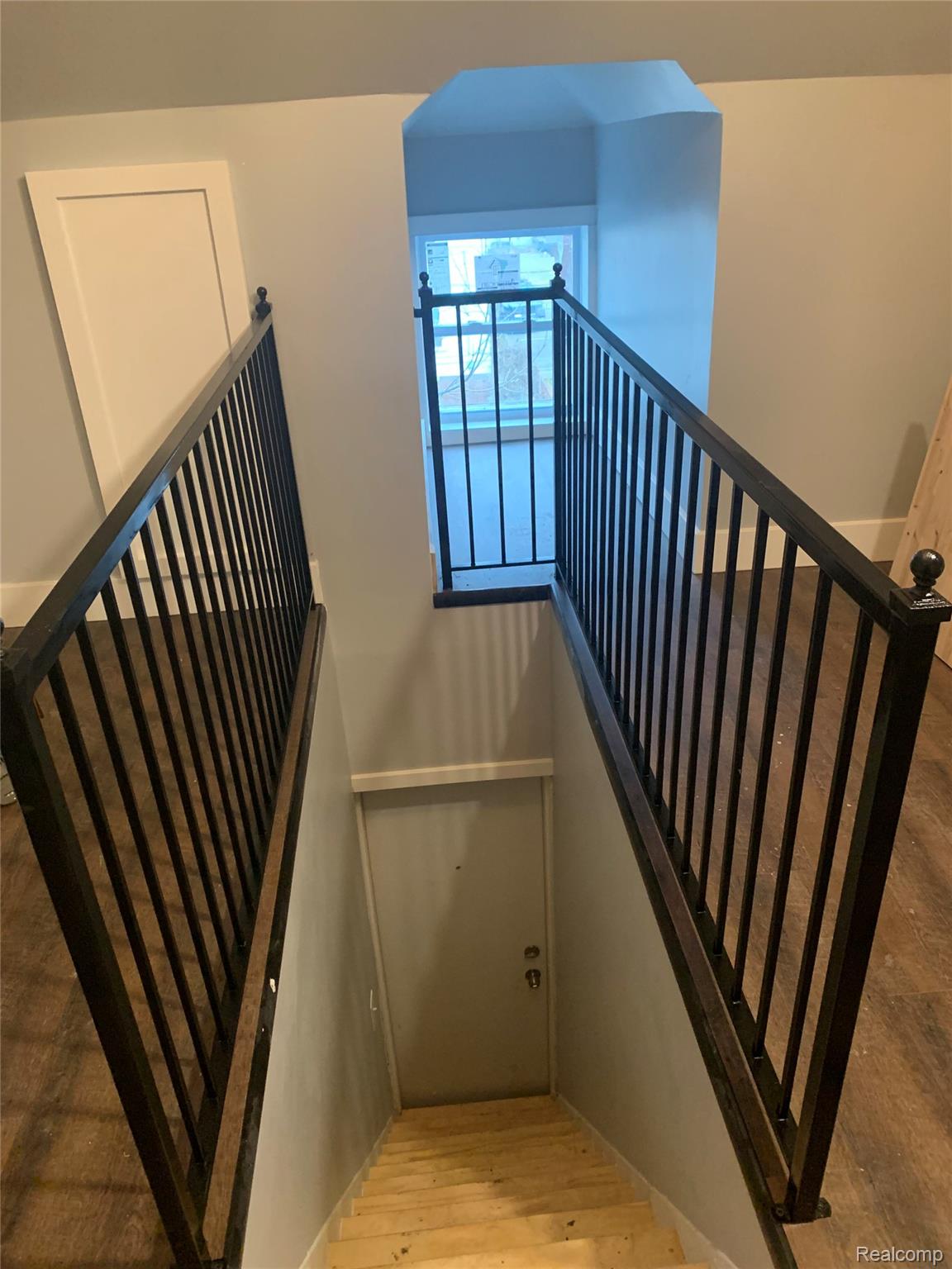132 Pilgrim Street, Unit STUDIO 3 Highland Park, MI 48203 - Photo 6 of 10 Stairs featuring wood finished floors