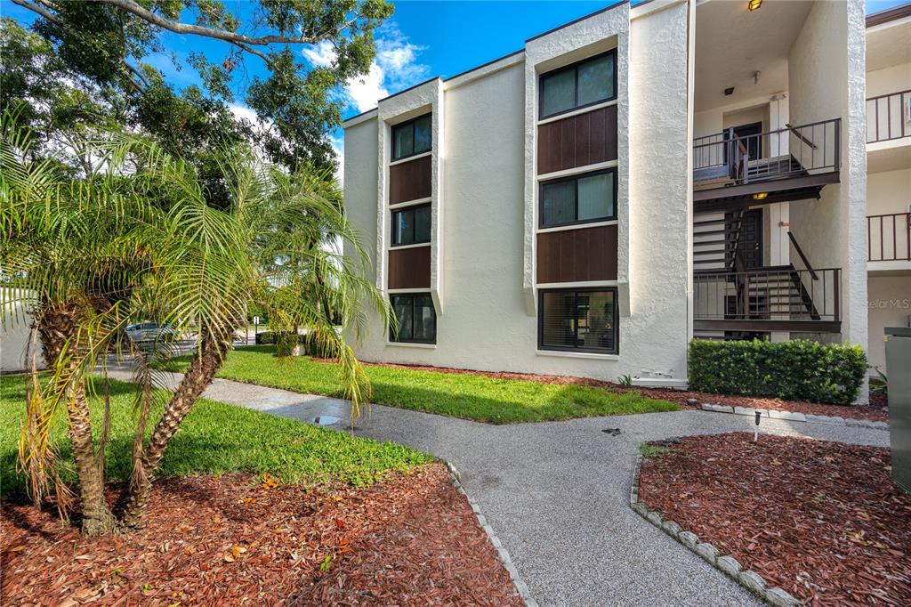 2207 Belleair Road, Unit B4 Clearwater, FL 33764 - Photo 35 of 37 a view of a yard in front of a house