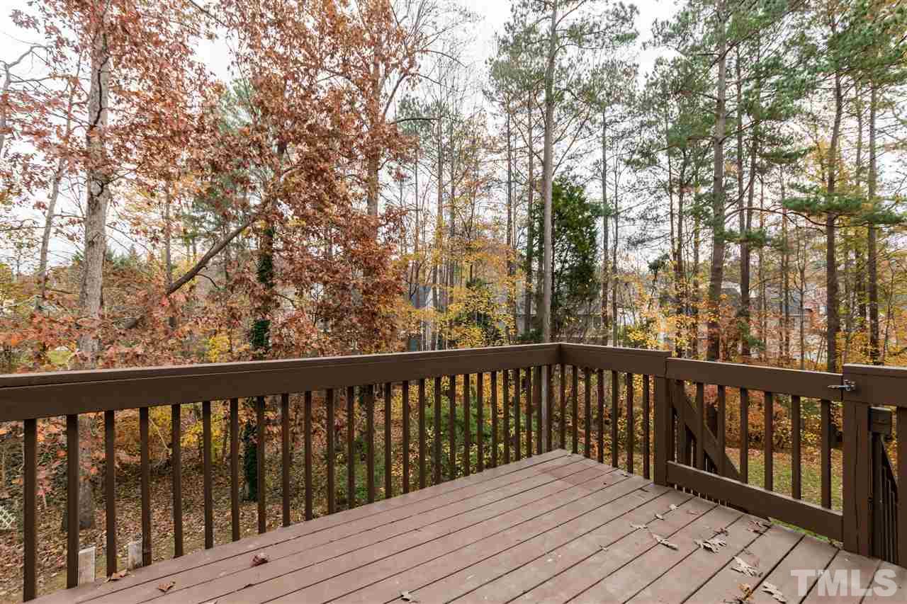 4100 Crystal Clay Court Raleigh, NC 27613 - Photo 22 of 25 a balcony with wooden floor and fence
