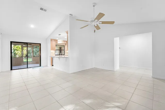 a view of kitchen with stainless steel appliances cabinets