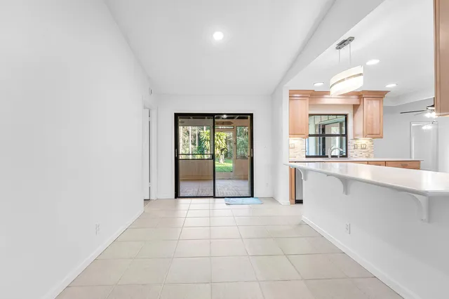a kitchen with refrigerator cabinets and a sink