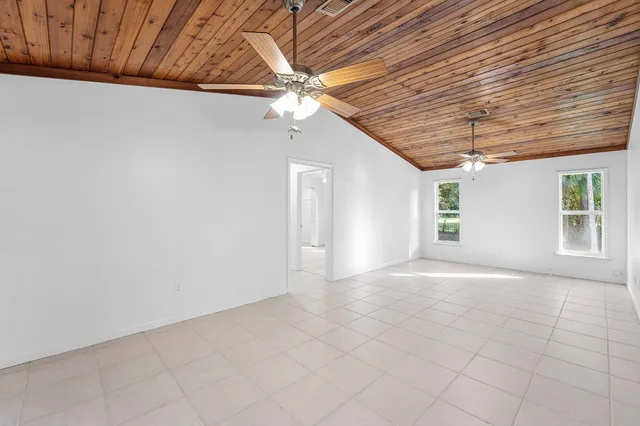 a view of a livingroom with an empty space and a ceiling fan