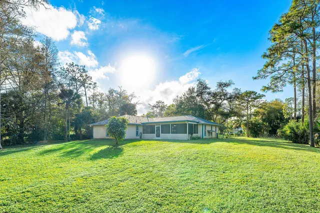 a view of a park with swings and a slide