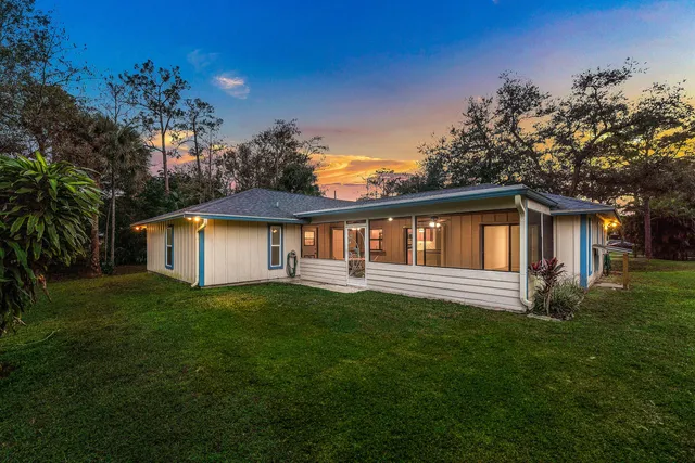 a view of a house with a tree