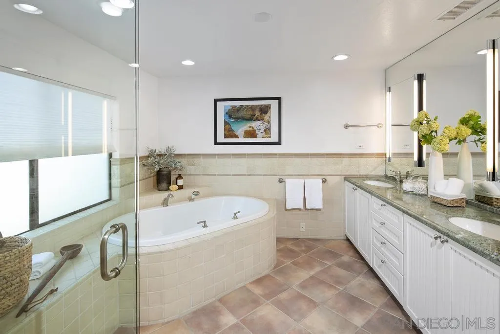 6117 La Flecha Rancho Santa Fe, CA 92067 - Photo 16 of 37 a spacious bathroom with a tub sink and mirror