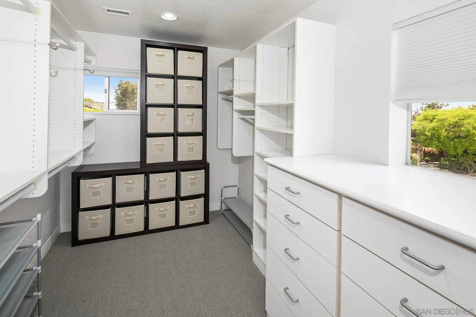 6117 La Flecha Rancho Santa Fe, CA 92067 - Photo 17 of 37 a spacious bathroom with a double vanity sink and a large mirror