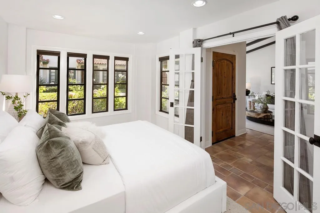 6117 La Flecha Rancho Santa Fe, CA 92067 - Photo 19 of 37 a spacious bedroom with a large bed and a large window