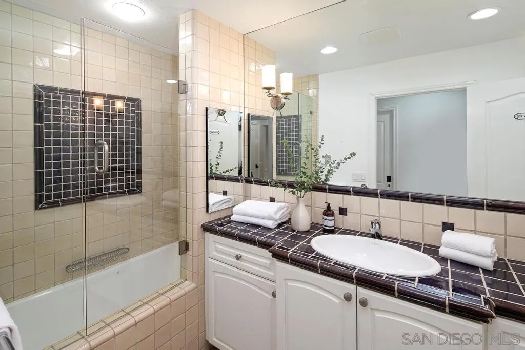 6117 La Flecha Rancho Santa Fe, CA 92067 - Photo 20 of 37 a bathroom with a granite countertop sink and a mirror