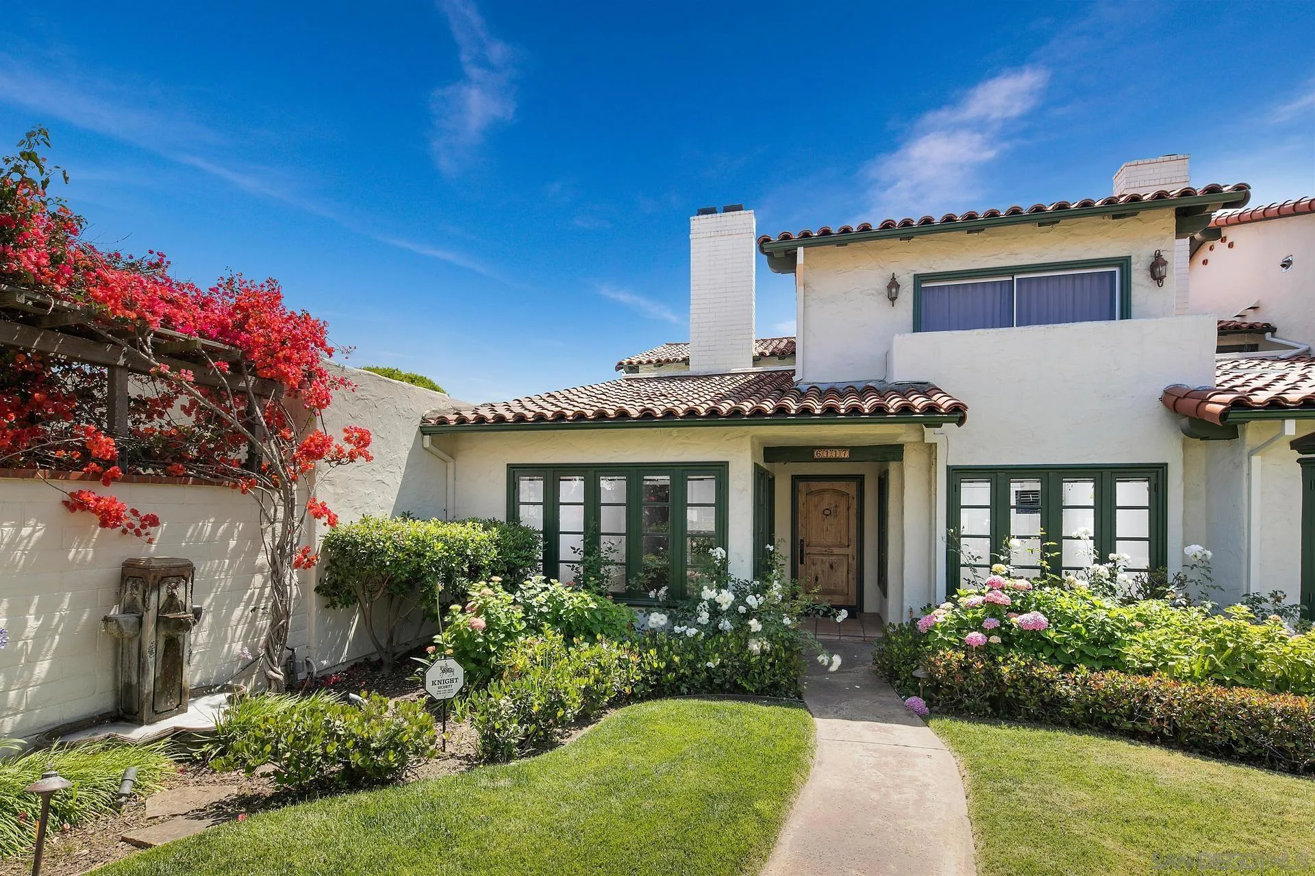 6117 La Flecha Rancho Santa Fe, CA 92067 - Photo 2 of 37 a front view of a house with a yard