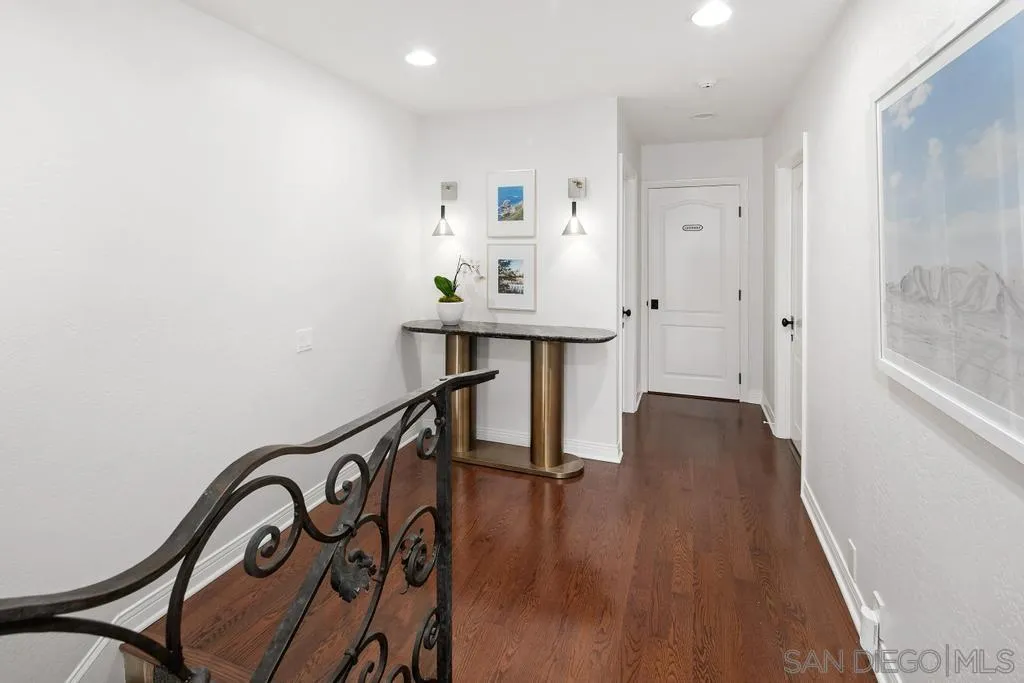 6117 La Flecha Rancho Santa Fe, CA 92067 - Photo 23 of 37 a view of a hallway with wooden floor