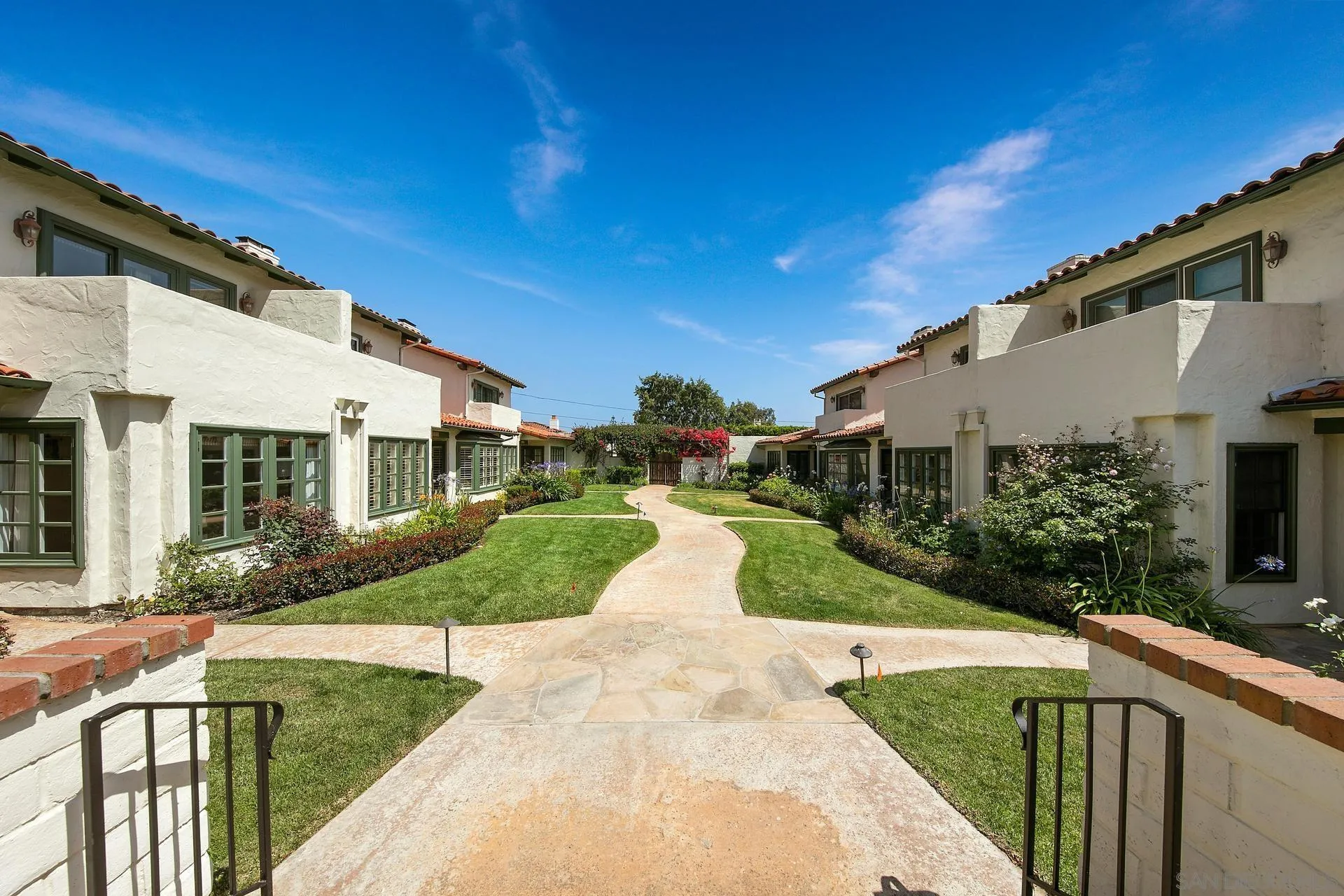 6117 La Flecha Rancho Santa Fe, CA 92067 - Photo 33 of 37 a view of a white house with a yard and potted plants