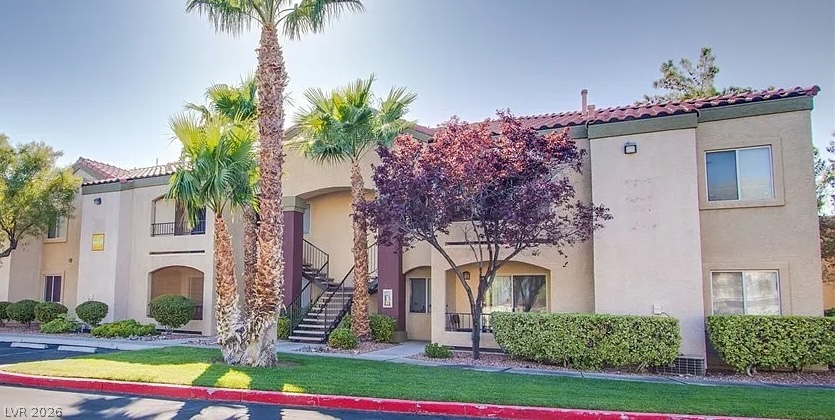 7885 West Flamingo Road, Unit 1003 Las Vegas, NV 89147 - Photo 2 of 7 Mediterranean-inspired multi-family residence with lush landscaping and easy access.