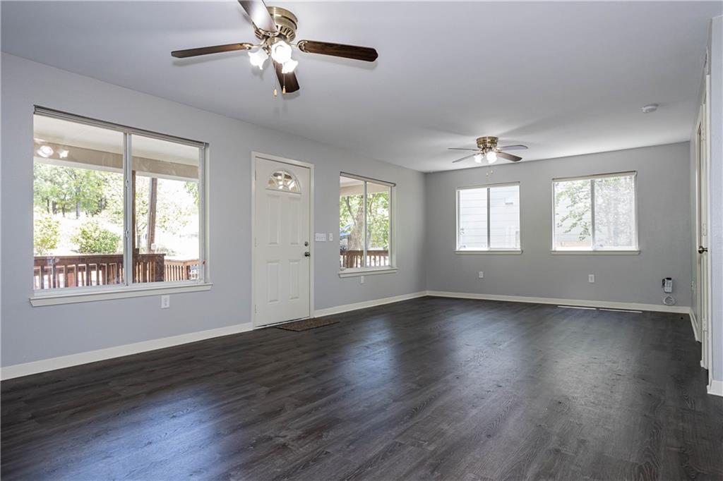 1326 Delano Street Austin, TX 78721 - Photo 8 of 23 Foyer with a ceiling fan and dark wood-type flooring