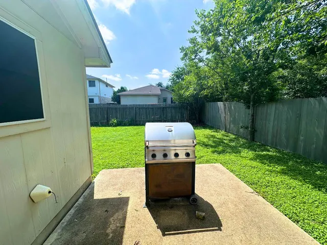a backyard of a house with lots of green space
